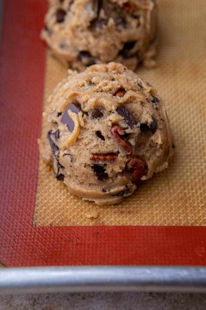 Cookie dough ball on tray ready to bake