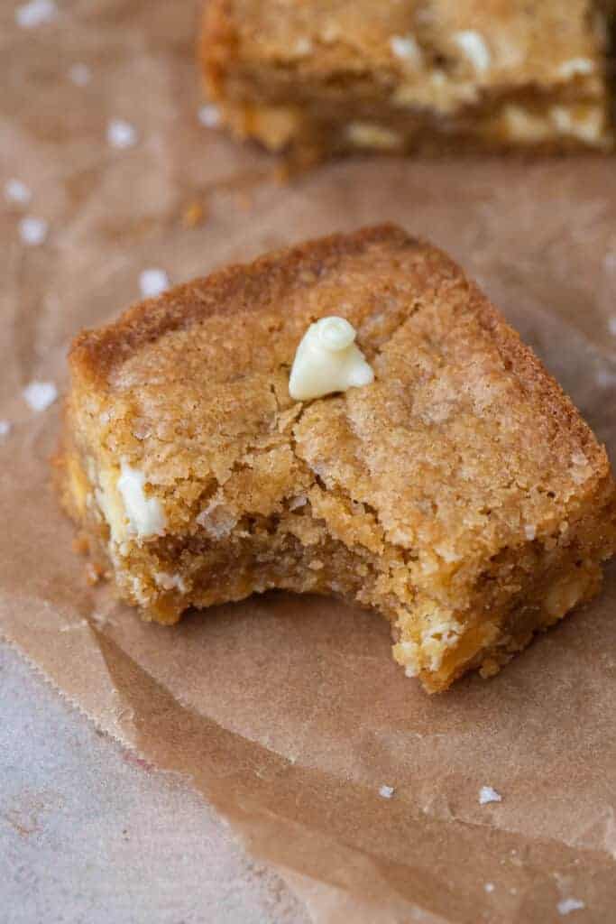 White chocolate blondies slice with a bite taken out of it