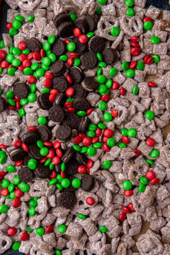 Chocolate-coated cereal tossed with powdered sugar in a resealable bag to evenly coat the snack mix.