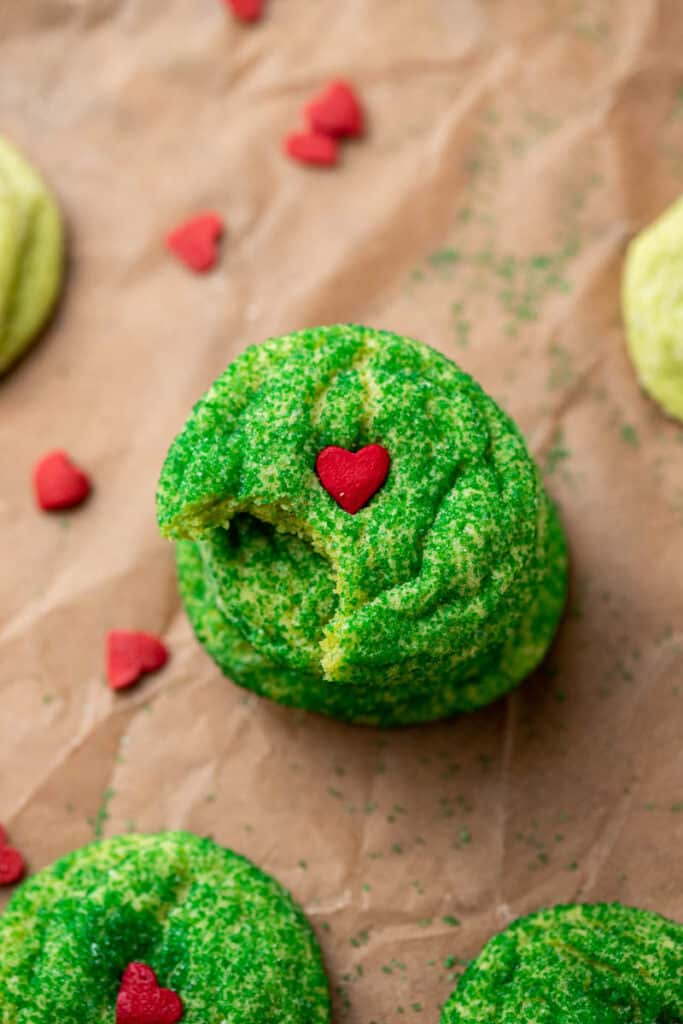 Grinch sugar cookie with a bite taken out of it