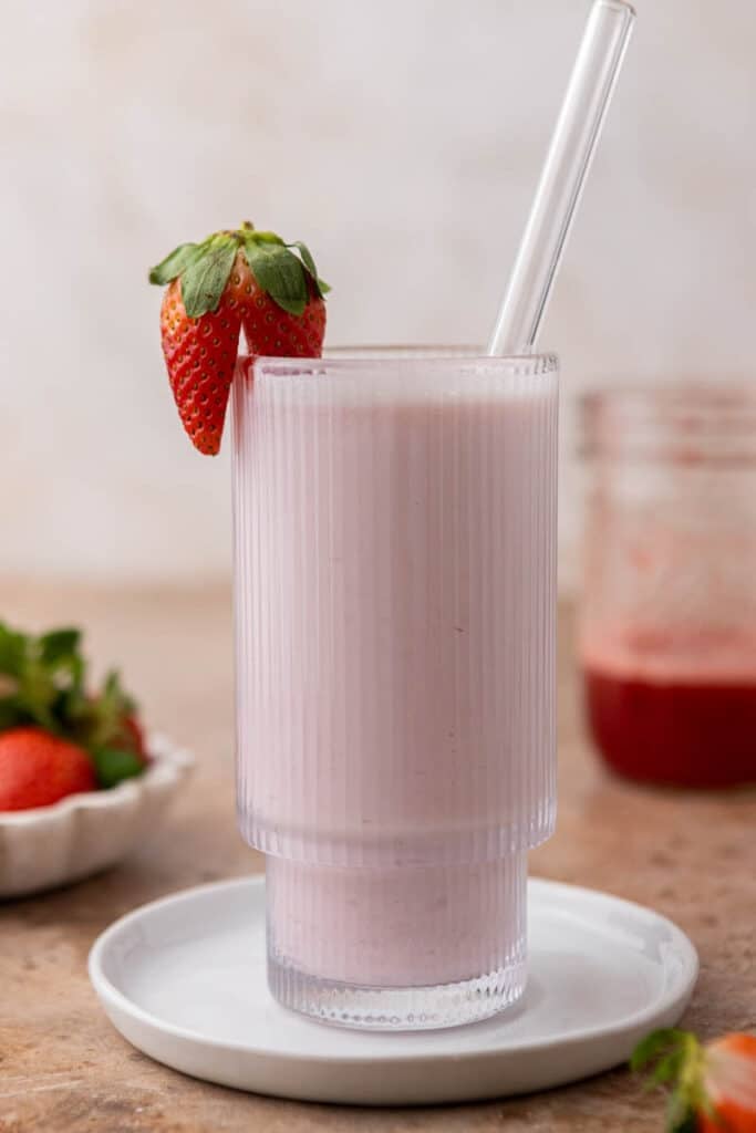 strawberry milk in a ribbed glass
