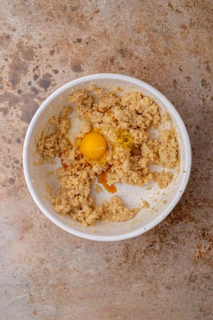 Butter, sugar, egg, and vanilla mixed together for cookie dough
