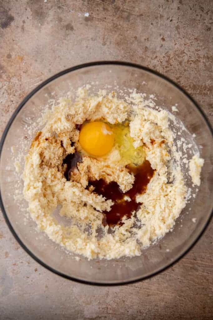 Butter, sugar, egg, and vanilla being mixed