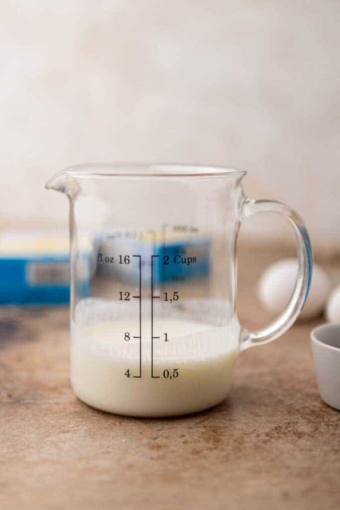 Buttermilk in a glass to make cornbread mix better