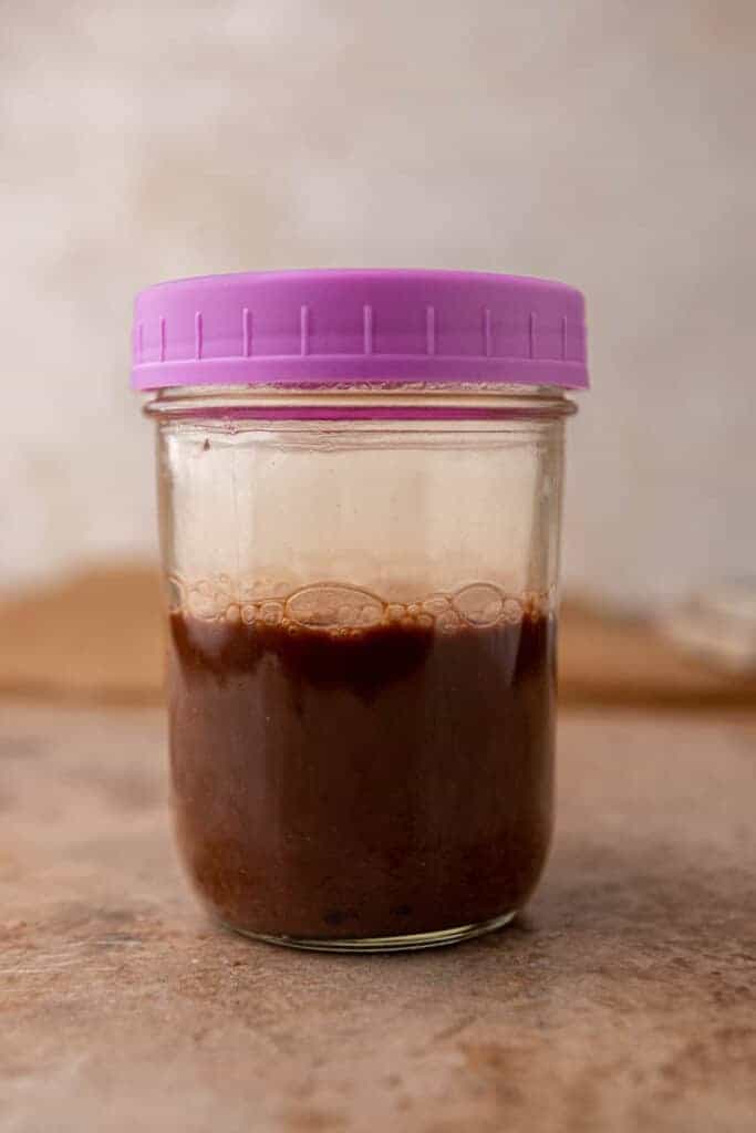 Cold brew and chocolate syrup shaken together in a sealed mason jar until fully dissolved.
