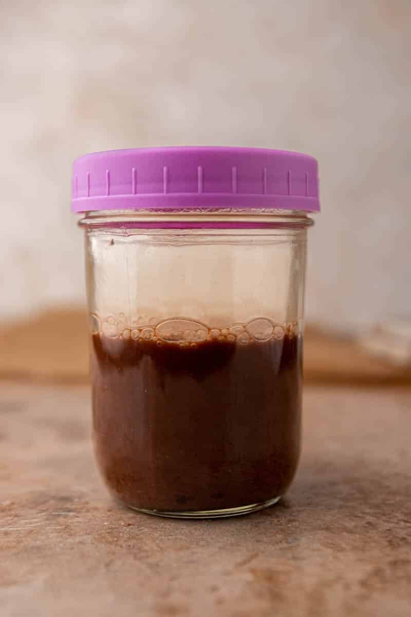 Shaken cold brew with chocolate sauce in a mason jar