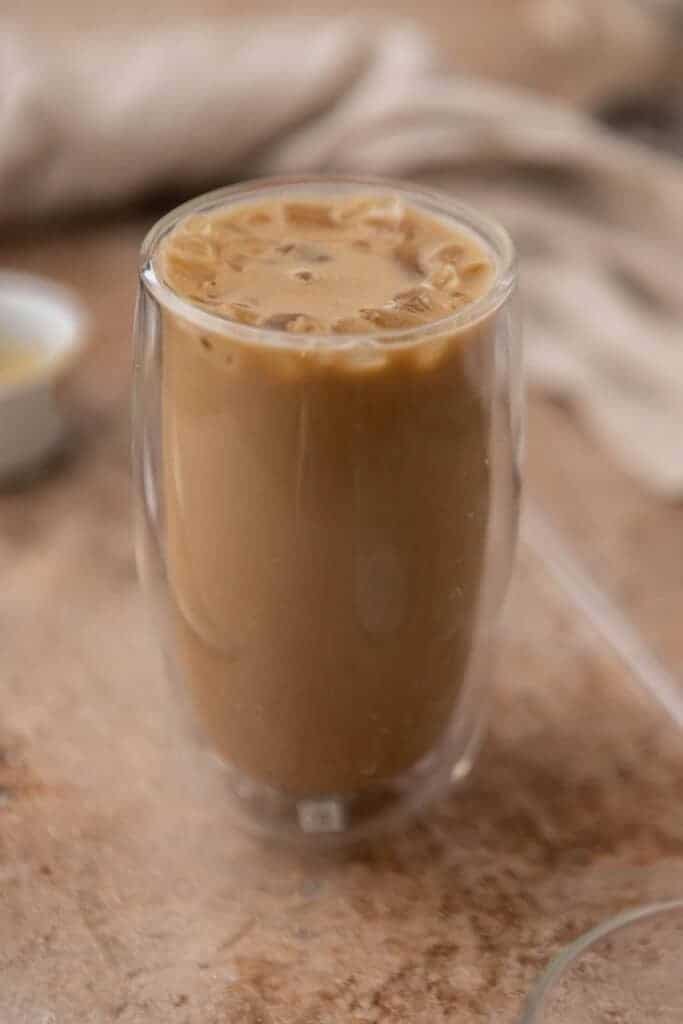 Glass full of caramel iced coffee