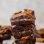 Small batch cookie butter brownies stacked on top of each other