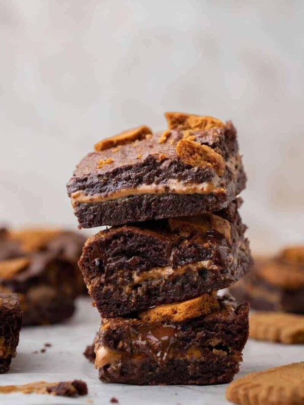 Small batch cookie butter brownies stacked on top of each other