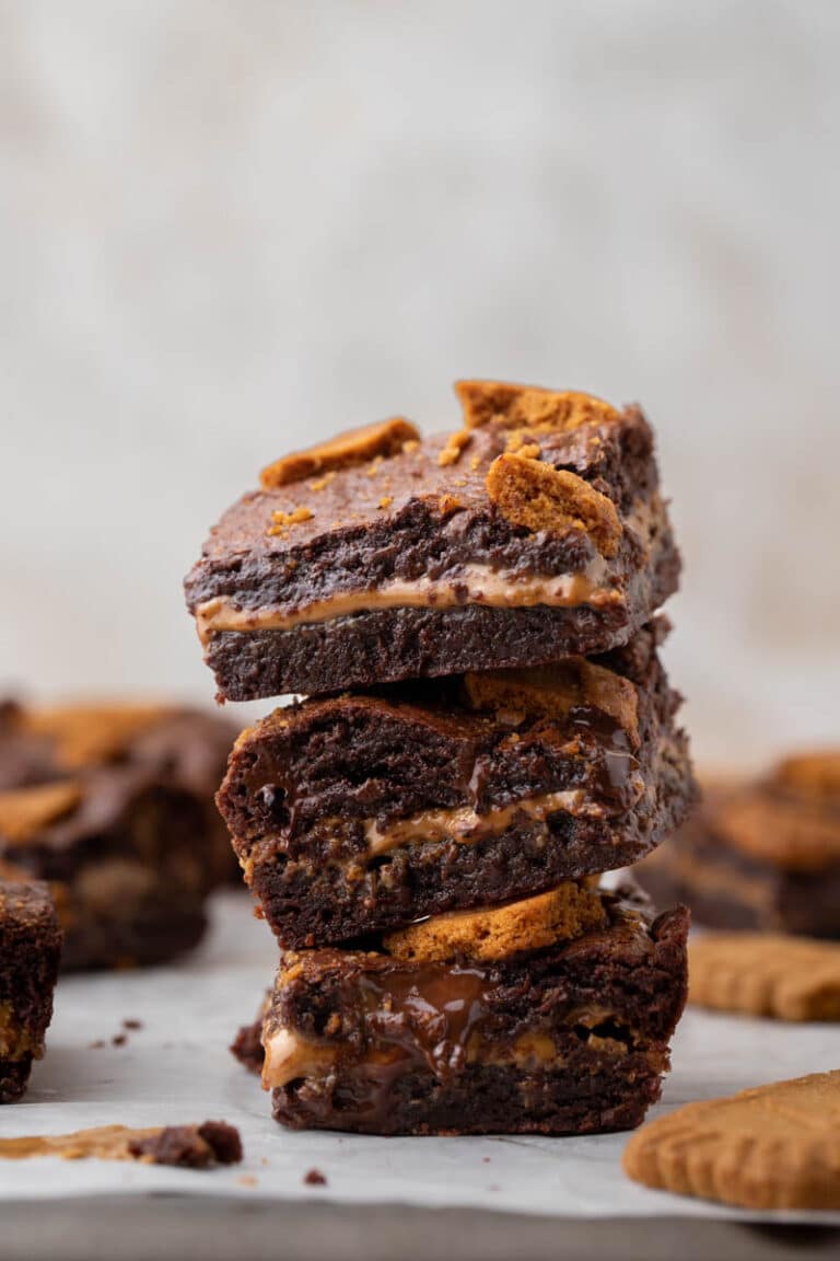 Small batch cookie butter brownies stacked on top of each other
