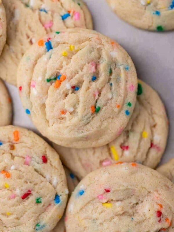 Delicious sprinkle sugar cookies on baking sheet