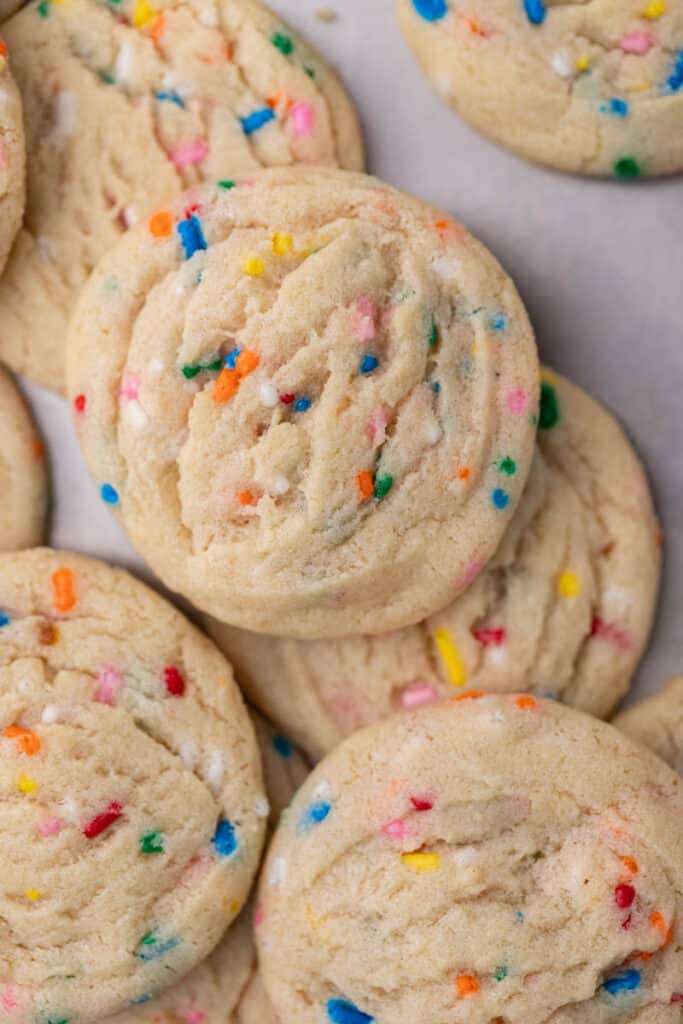 Delicious sprinkle sugar cookies on baking sheet