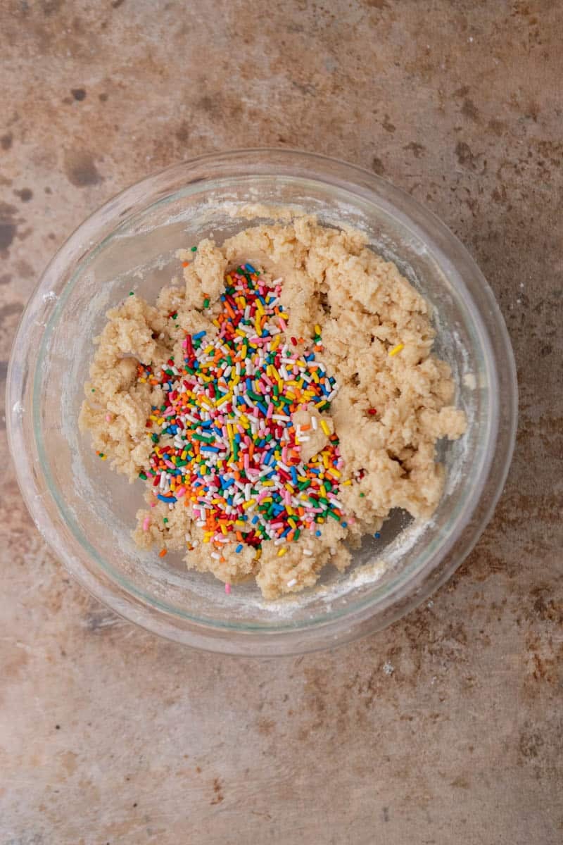 Sprinkle cookie dough in a bowl