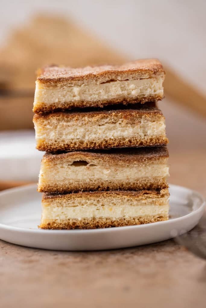 Churro cheesecake bars stacked