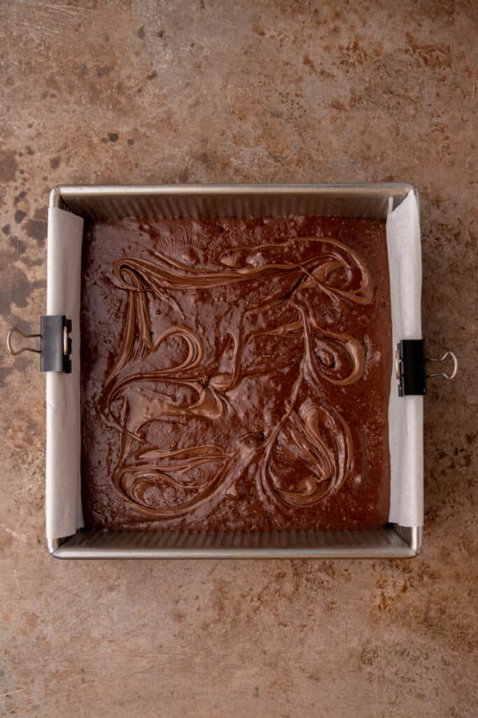Nutella brownie batter in a pan