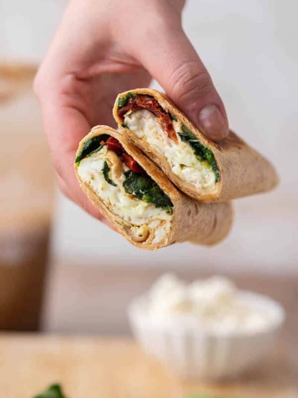 Hand holding Starbucks feta spinach wrap