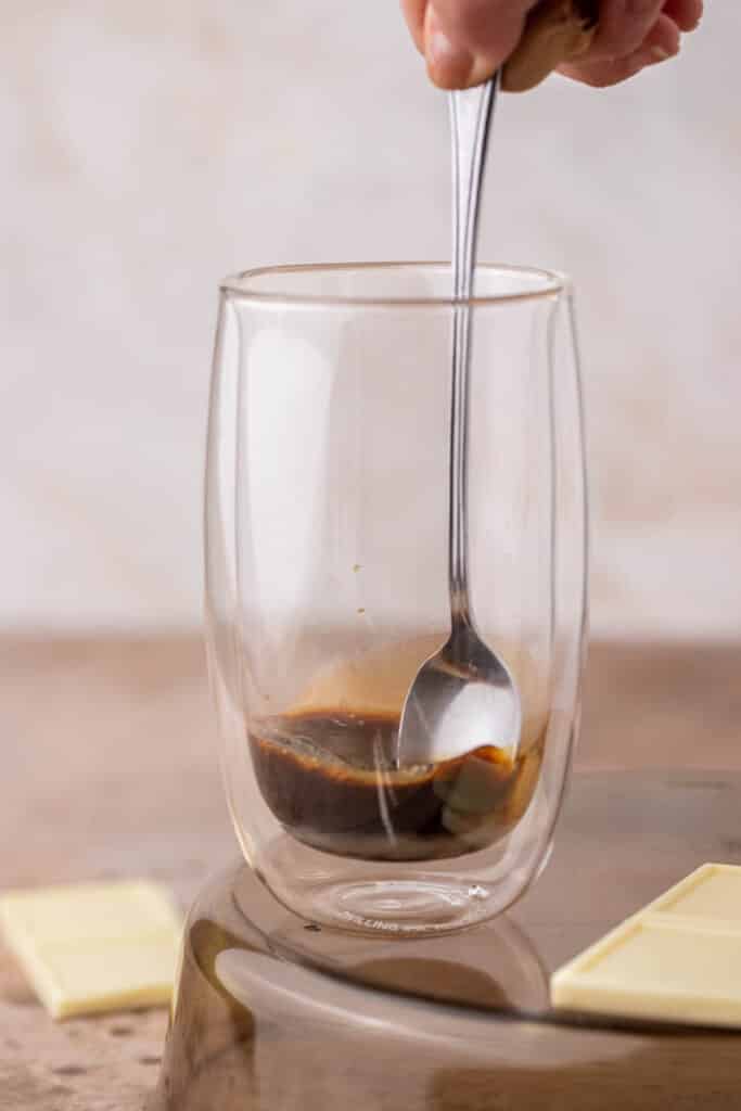 Spoon stirring espresso