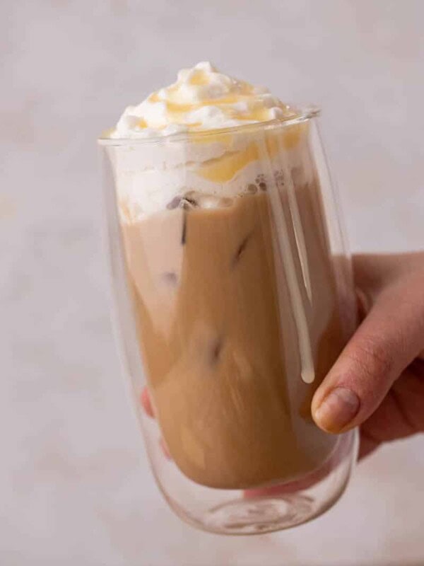 Hand holding iced Starbucks white mocha