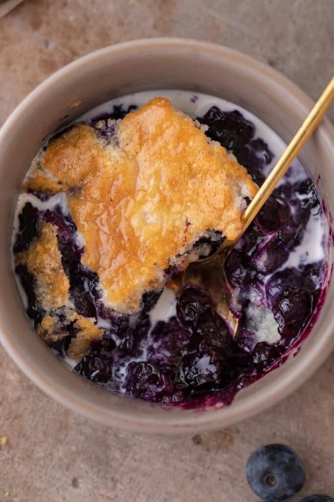 Overhead shot of blueberry cobbled in a bowl