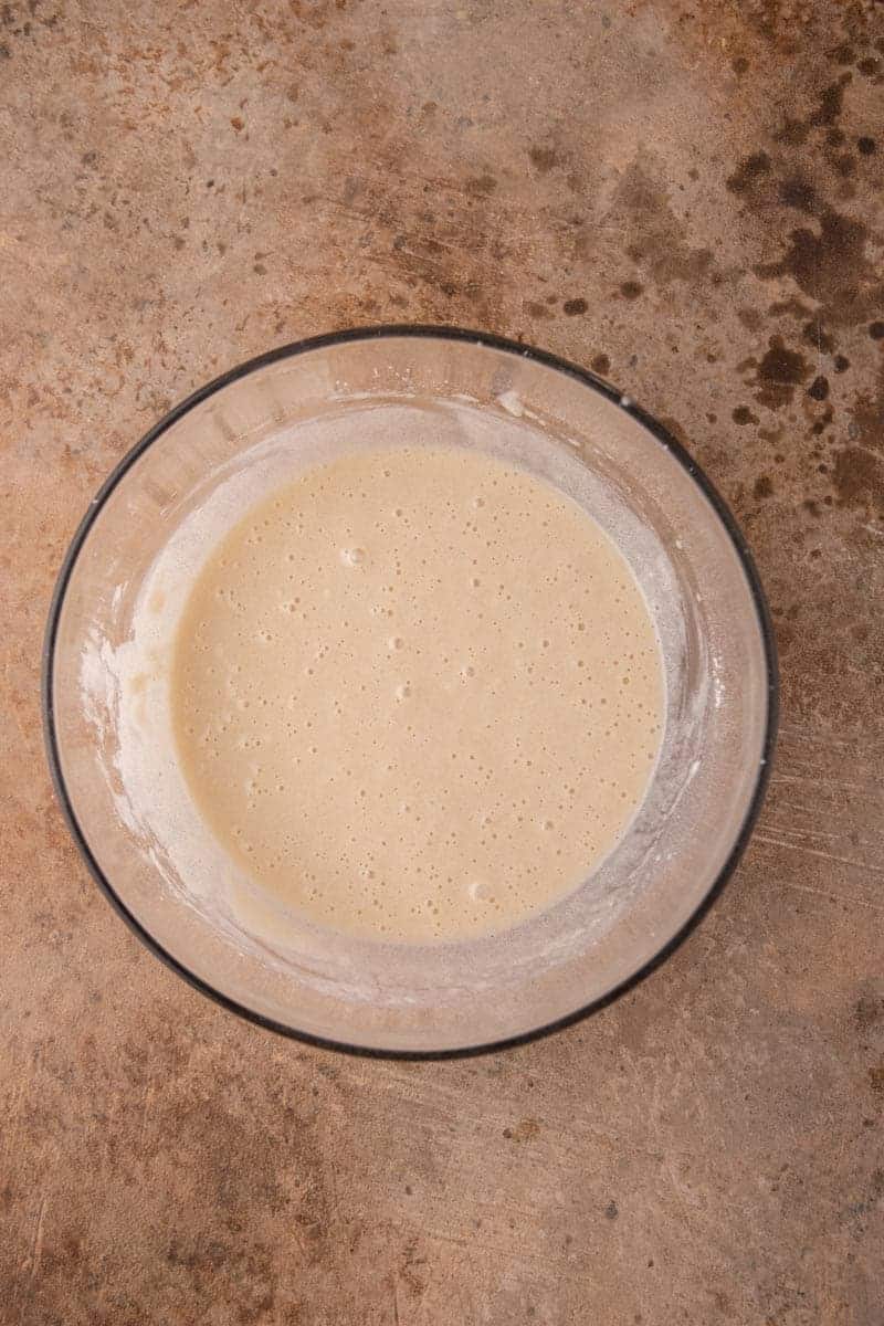 Smooth cobbler batter in a glass bowl.