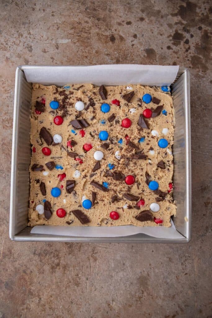 m&m's cookie dough in a baking pan