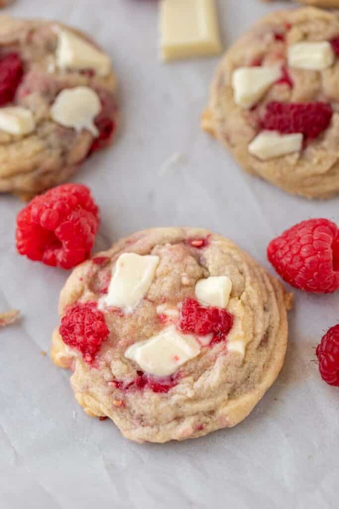 Close up of a raspberry white chocolate chunk cookie 