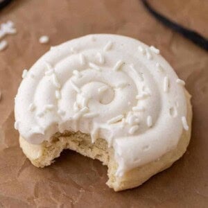 Crumbl nilla bean cupcake cookie with a bite taken out of it
