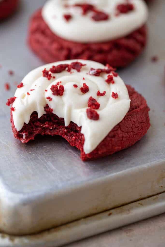 Red velvet cupcake cookie with a bite taken out of it