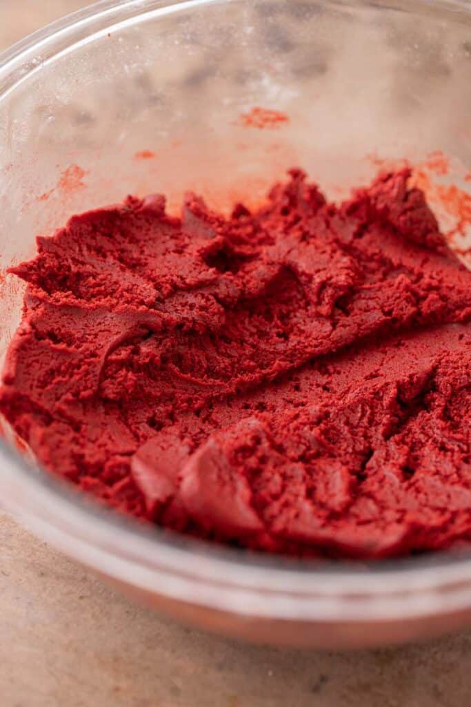 Crumbl red velvet cupcake cookie dough in a bowl