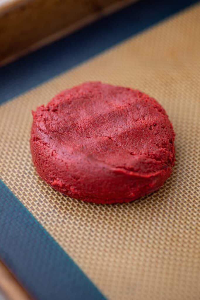 Crumbl red velvet cupcake cookie dough on baking pan