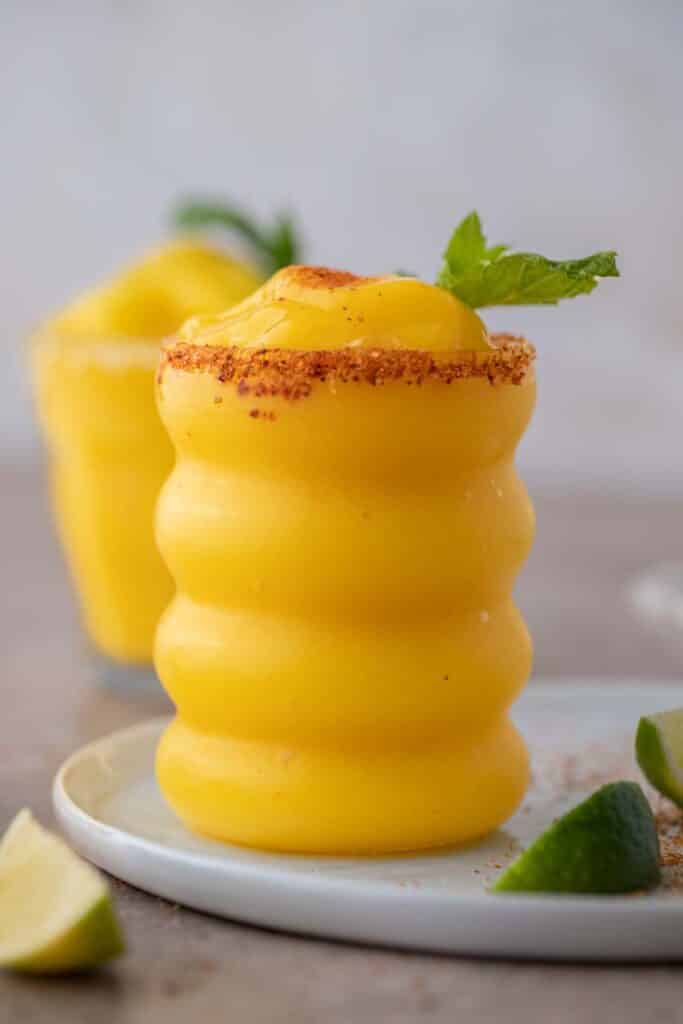 Frozen mango margaritas  in wiggly glass