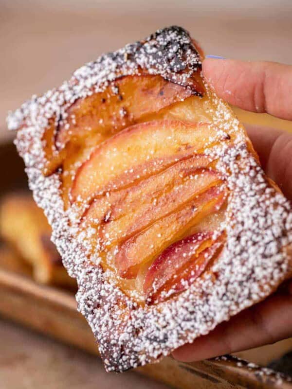 Hand holding upside down pastries