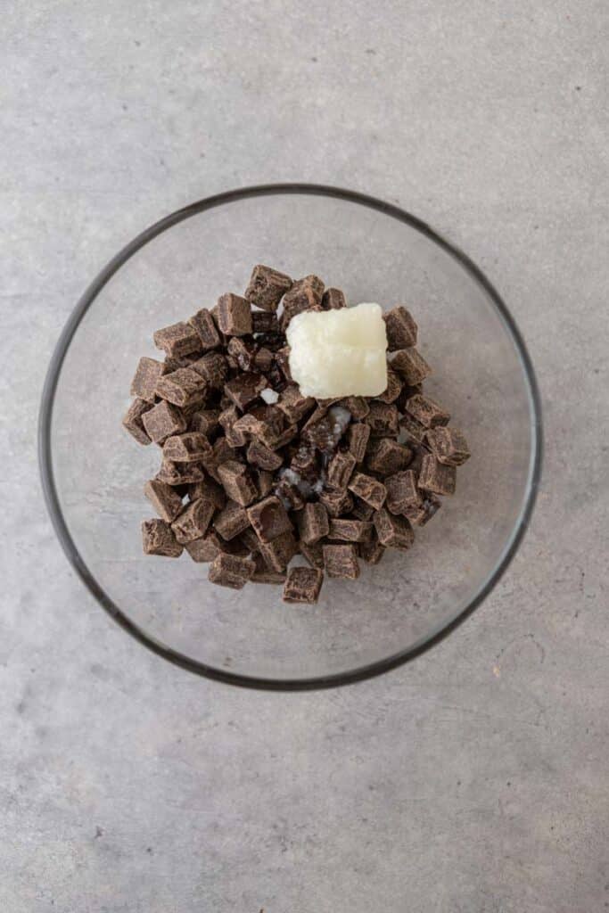 Chocolate chunks and coconut oil in a bowl