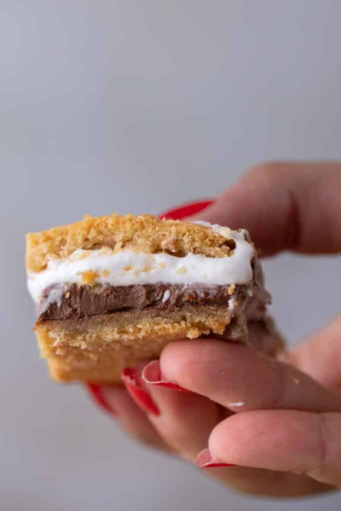 Hand holding s'mores bar cookies