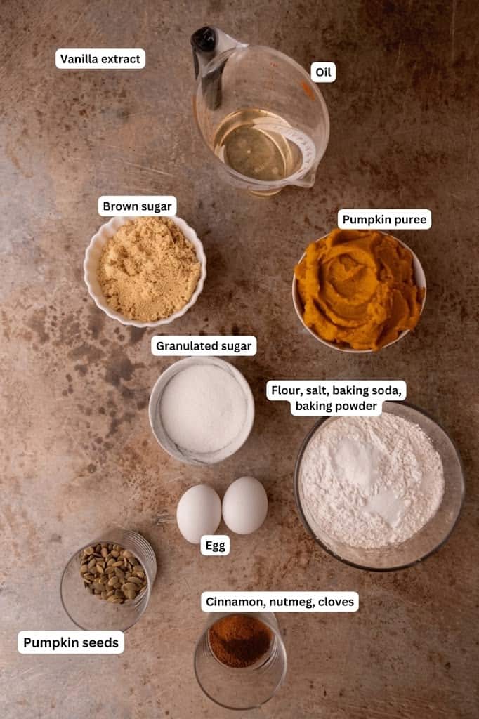 Labeled ingredients for Starbucks pumpkin bread including pumpkin puree, oil, brown sugar, spices and pepitas.