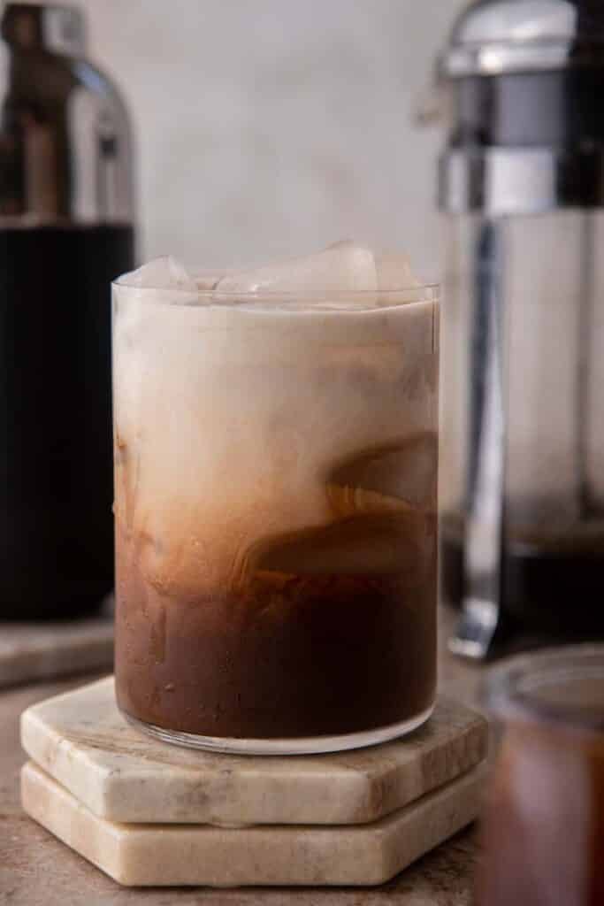 Iced mocha coffee with creamer on top