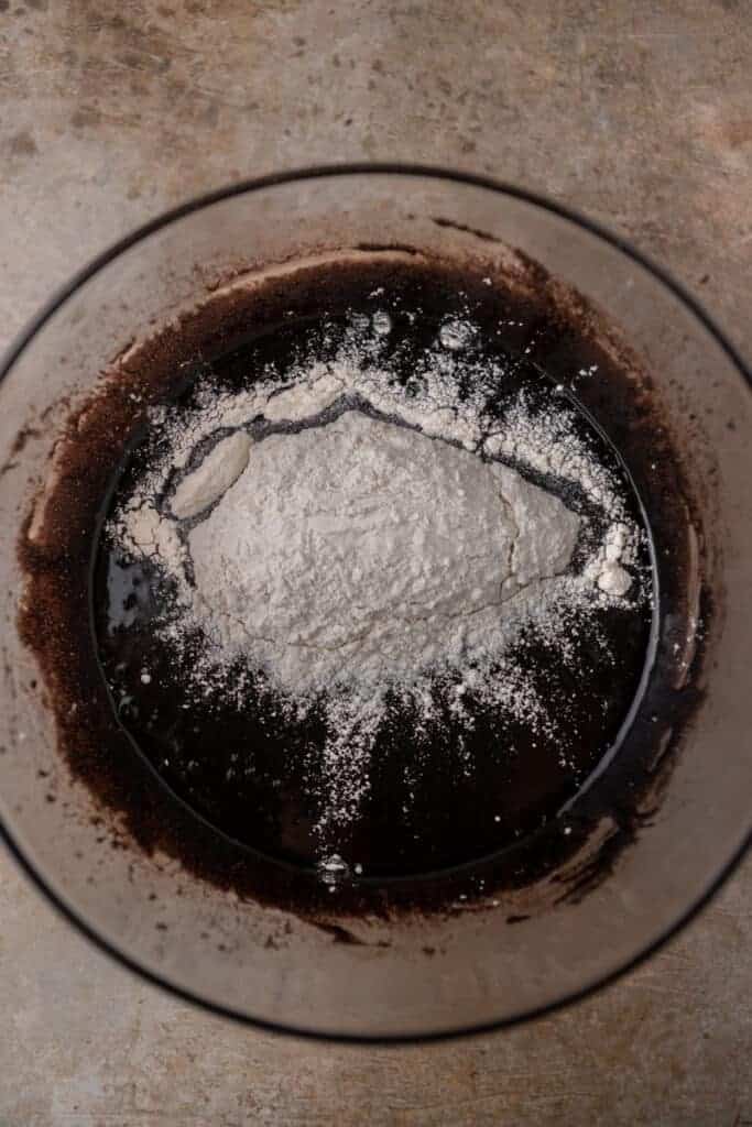 chocolate batter with flour on top