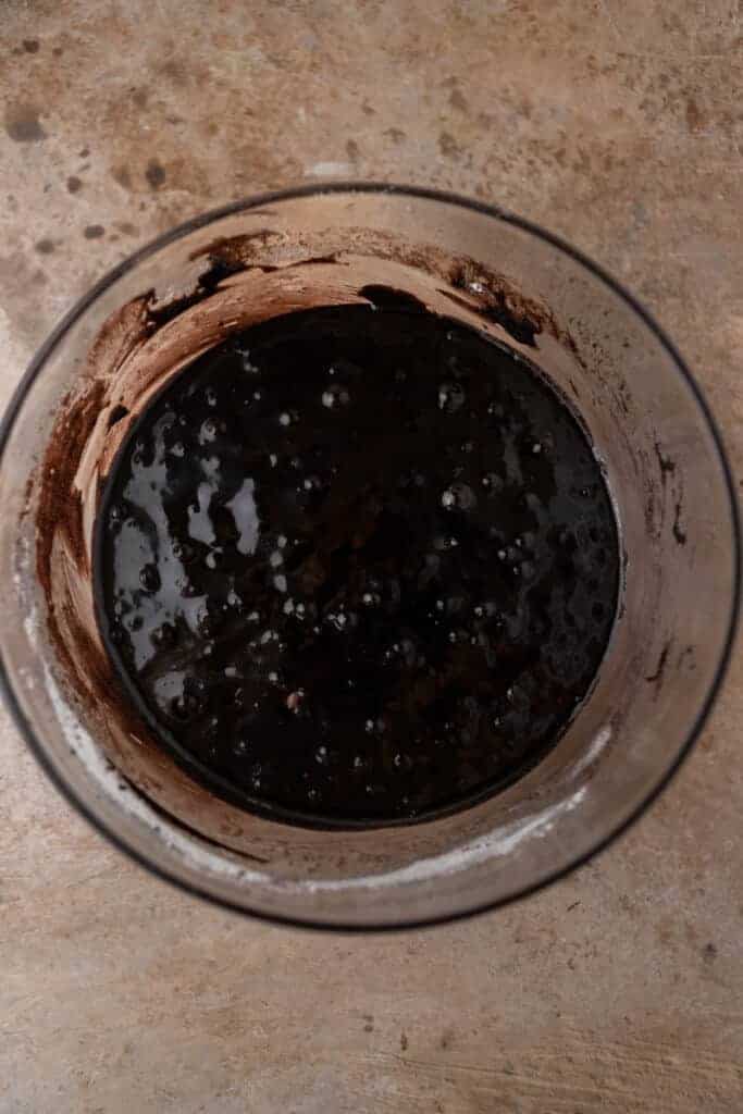 Dark cocoa brownie batter in a bowl