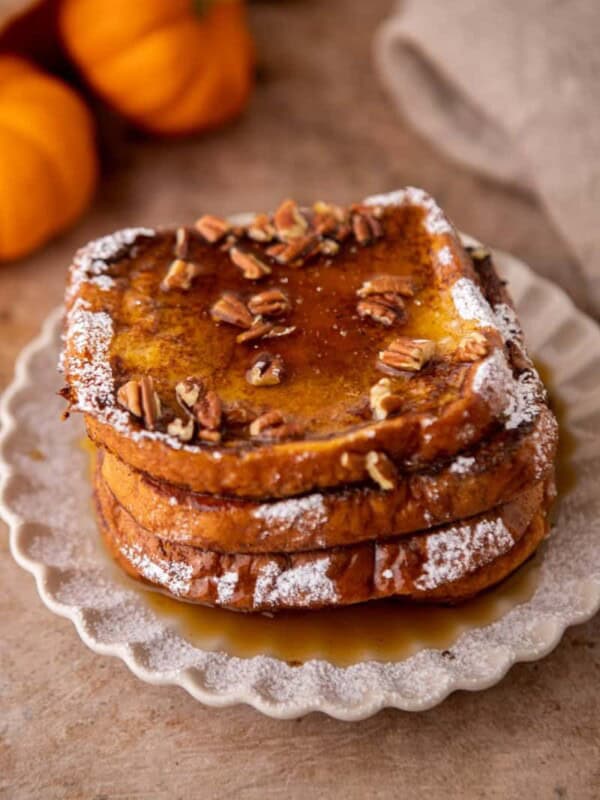 Pumpkin french toast with pecans and maple syrup on top