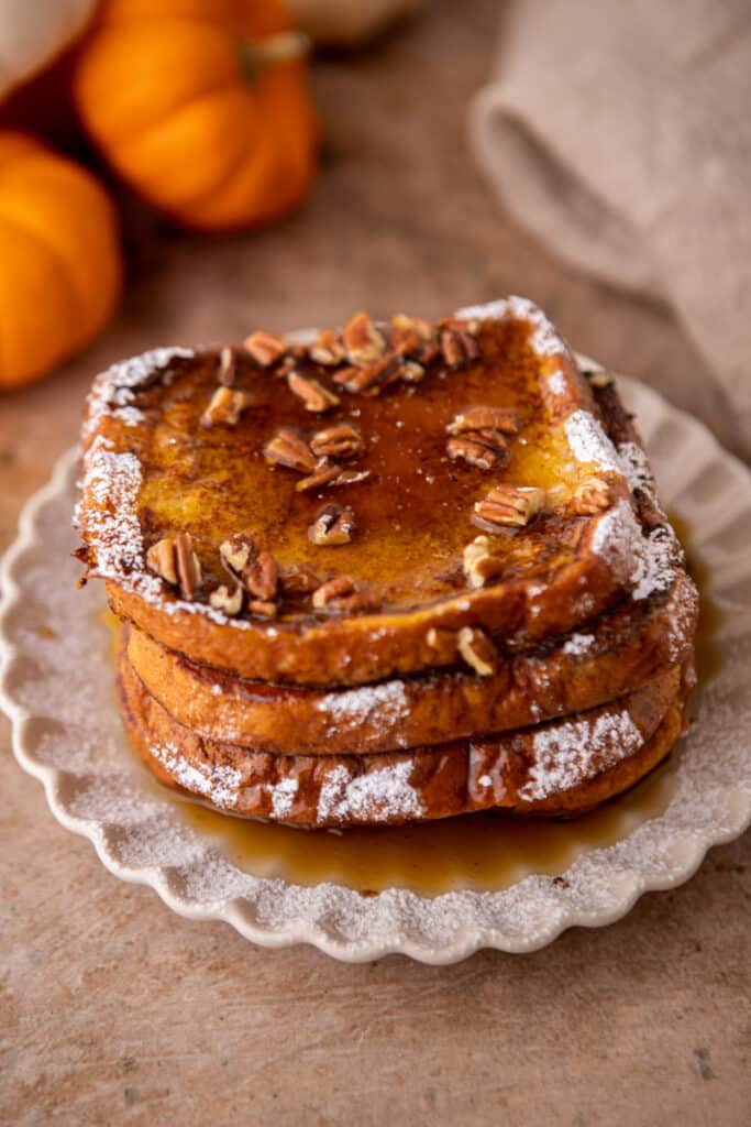 Pumpkin french toast with pecans and maple syrup on top 