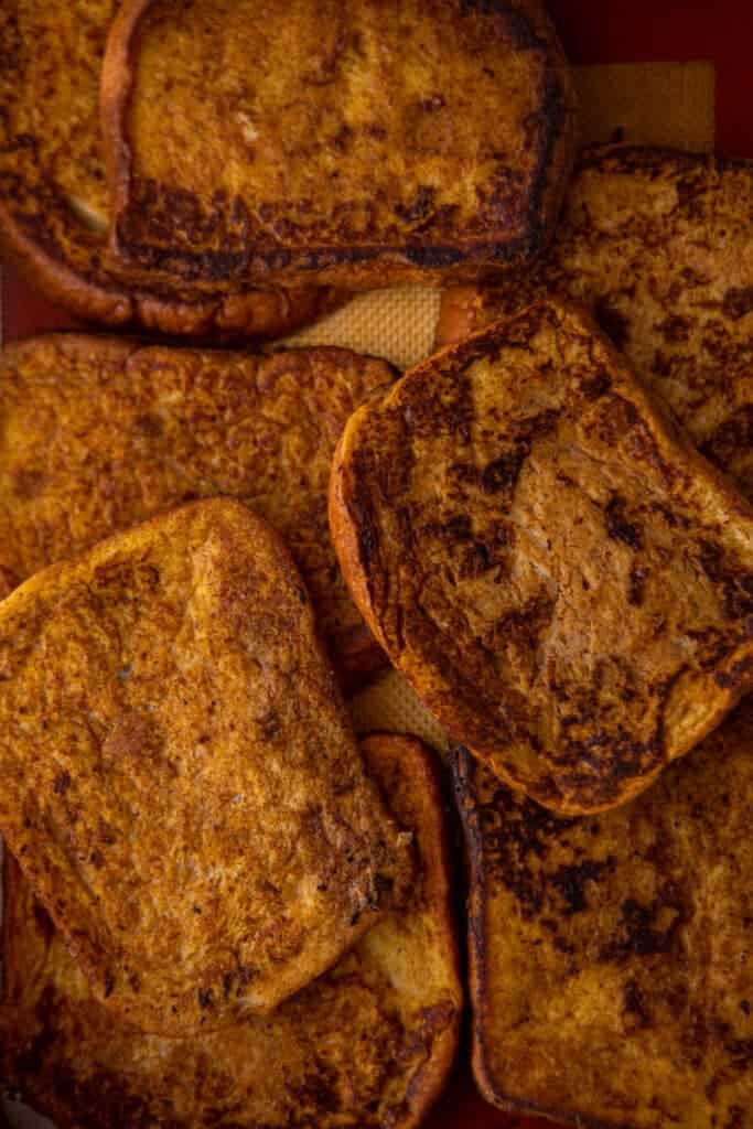Slices of pumpkin French toast showing golden brown outsides.
