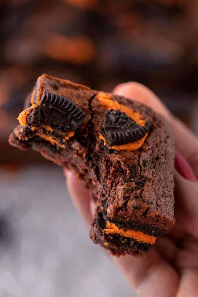 Hand holding Oreo brownies