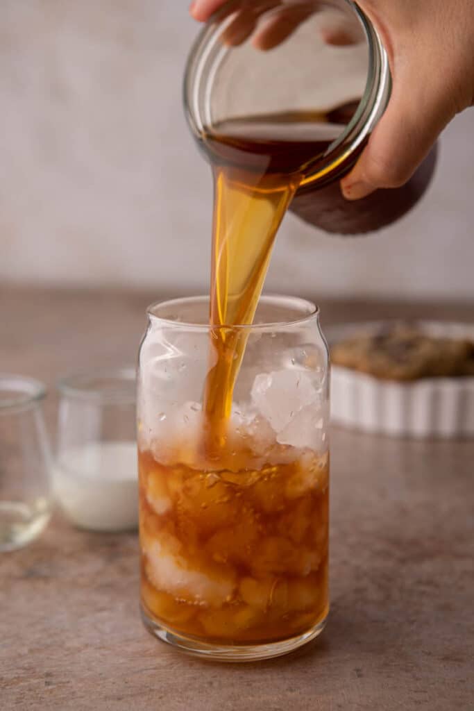 Iced coffee being poured in coffee