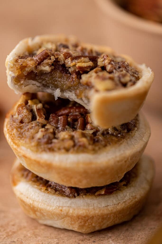 Pecan pie stack with a mini pie with a bite taken out of it