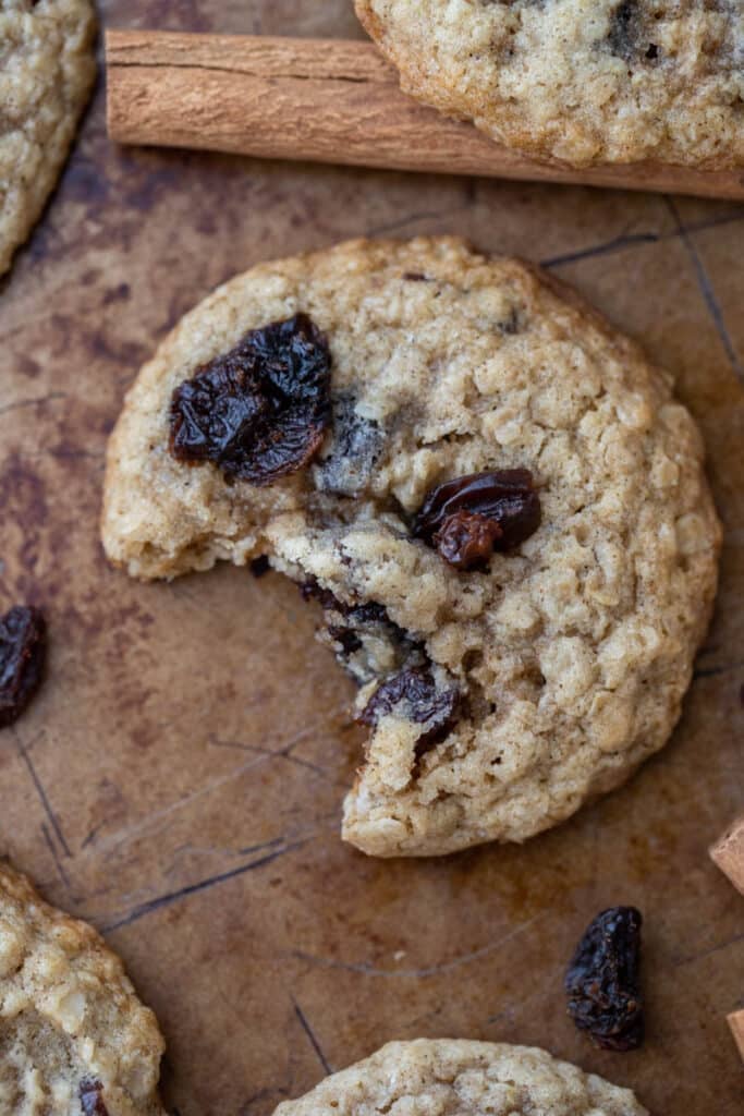 Close up of oatmeal raisin cookie with a bite taken out of it