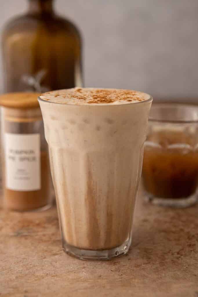 Tall glass of Starbucks pumpkin cream chai tea latte