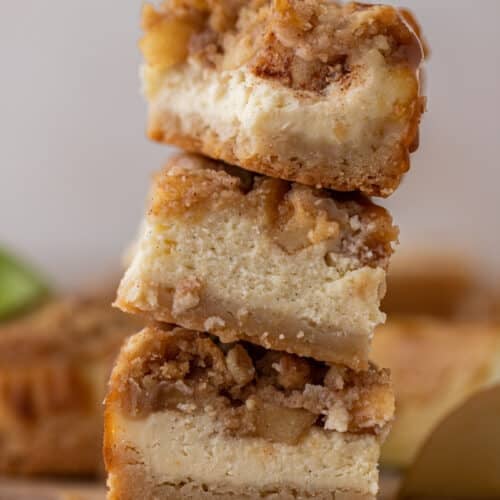 Stack of The best apple cheesecake bars with streusel crisp on top