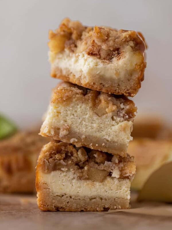 Stack of The best apple cheesecake bars with streusel crisp on top