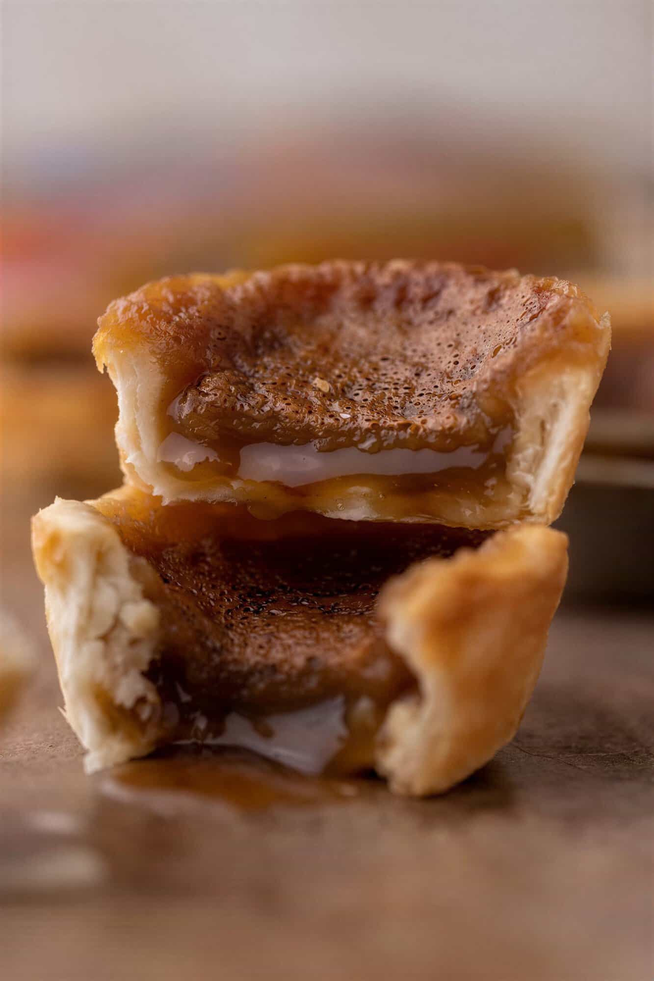 Canadian butter tarts cut open and stacked on top of each other