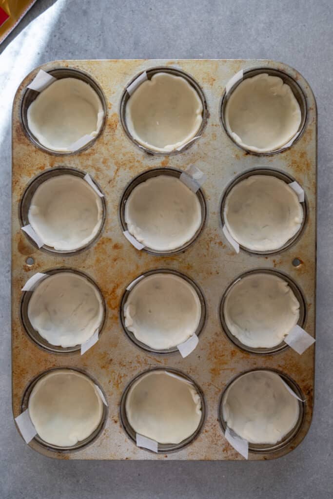 Pie crust pressed into muffin tin